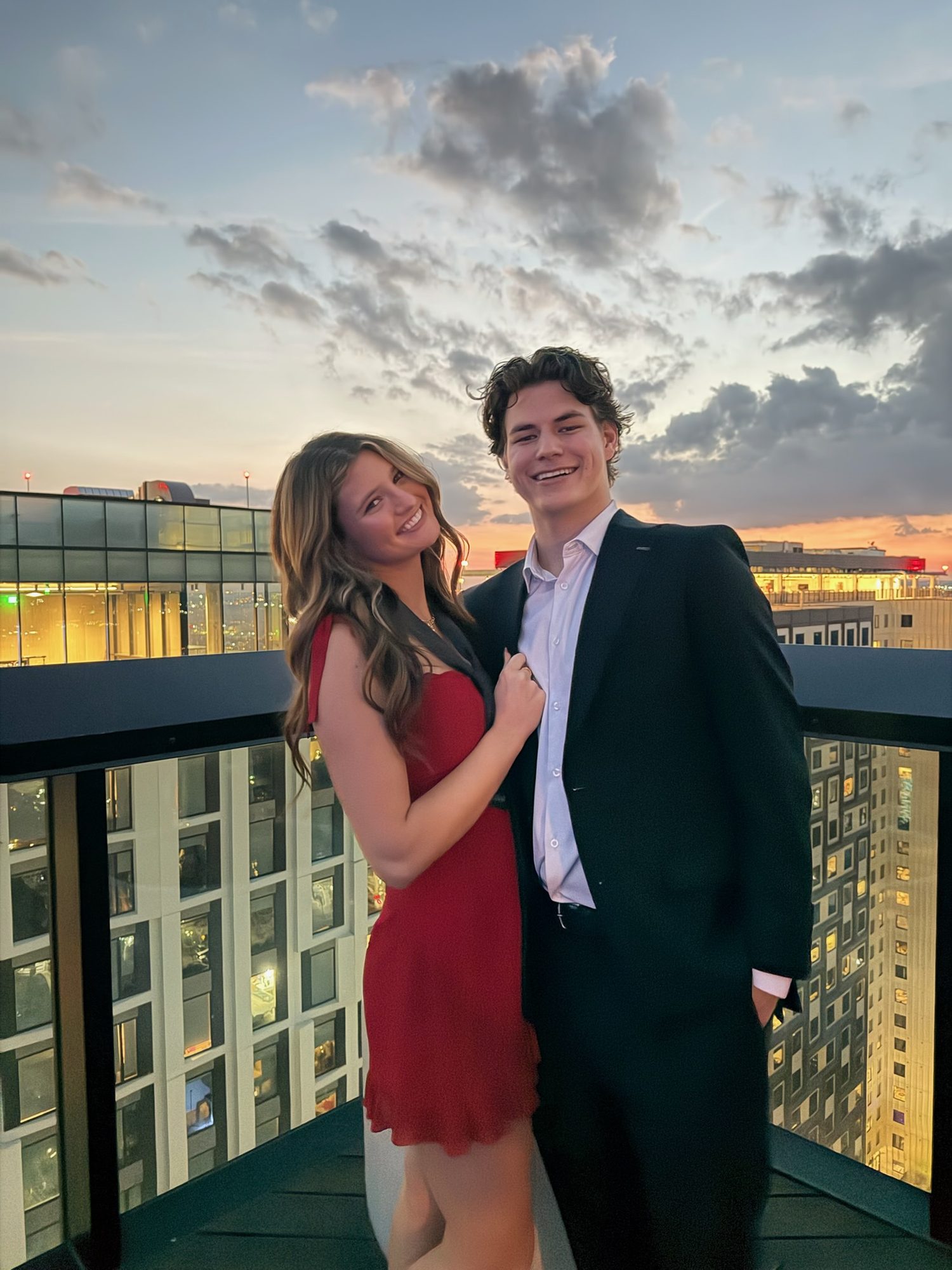 Brock and Anna on a rooftop at sunset